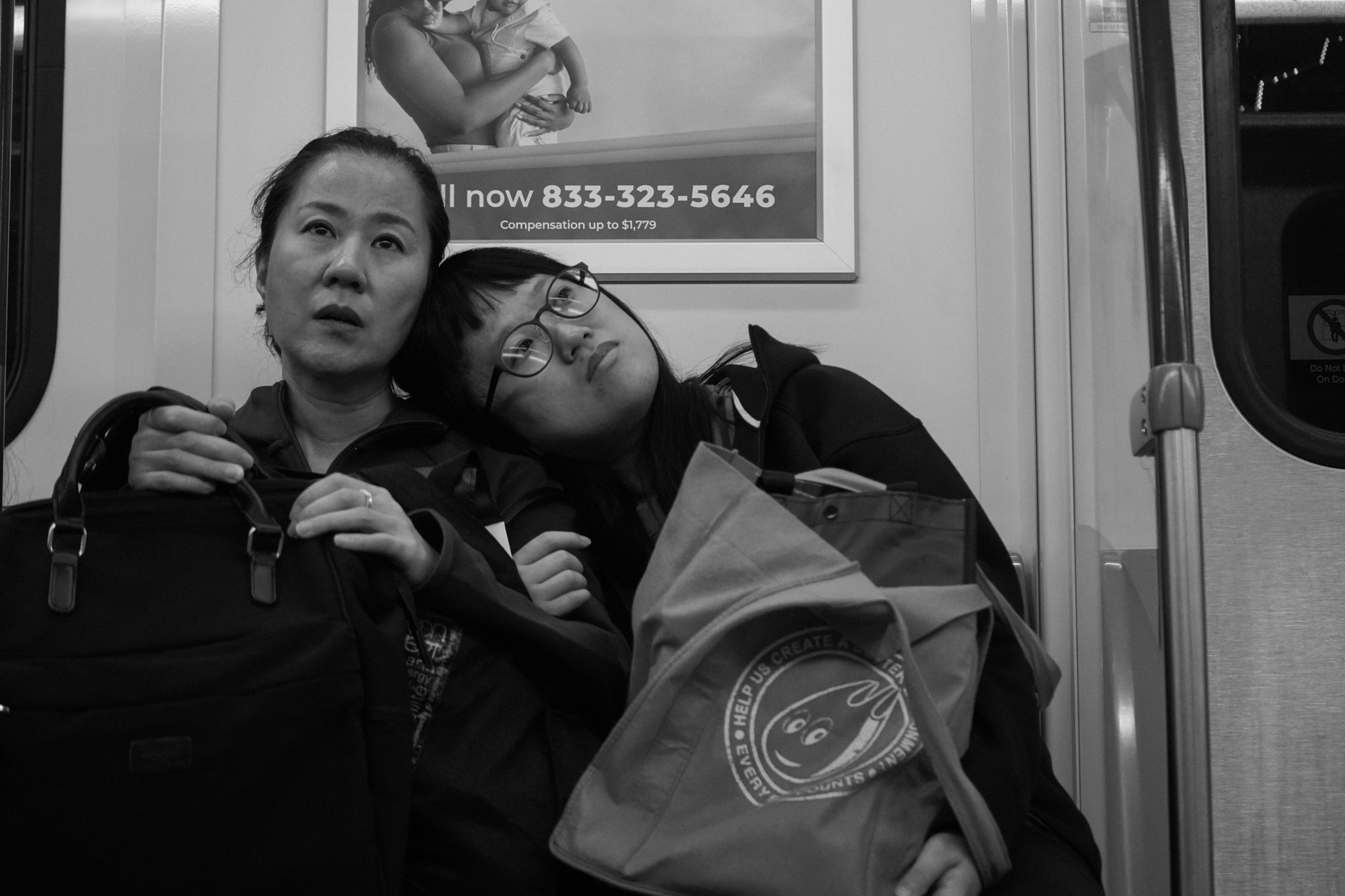 Woman resting her head on a companion's shoulder