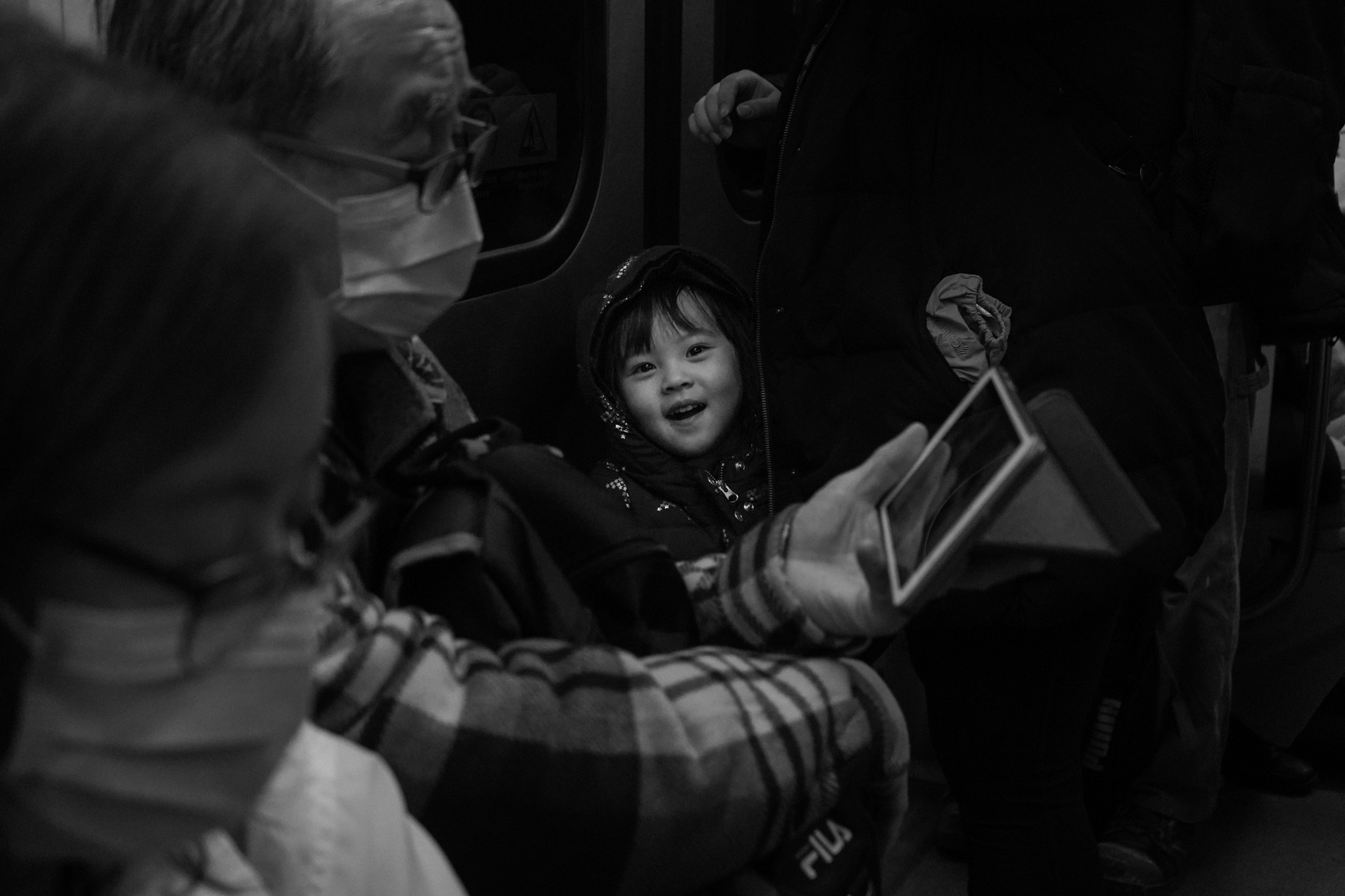 Child laughing on the subway