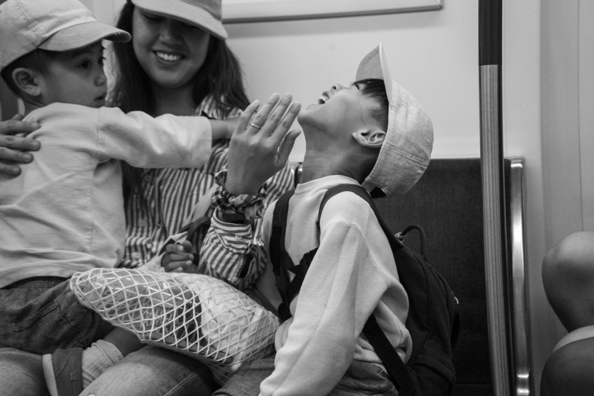 Family laughing together on the train