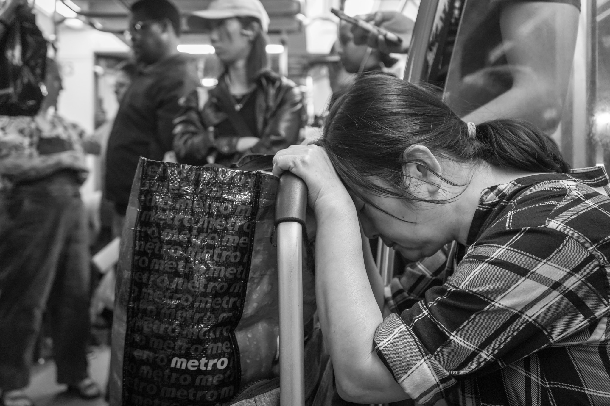 Woman sleeping against the handrail